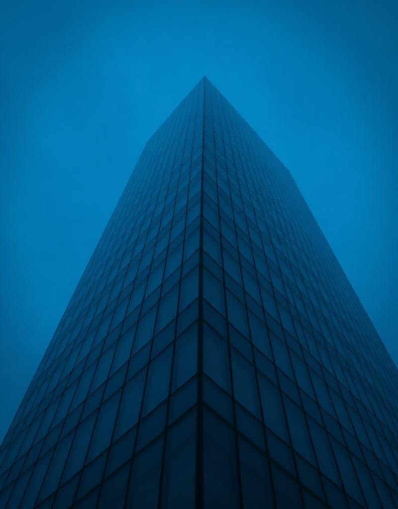 Architectural skyscraper against a navy sky